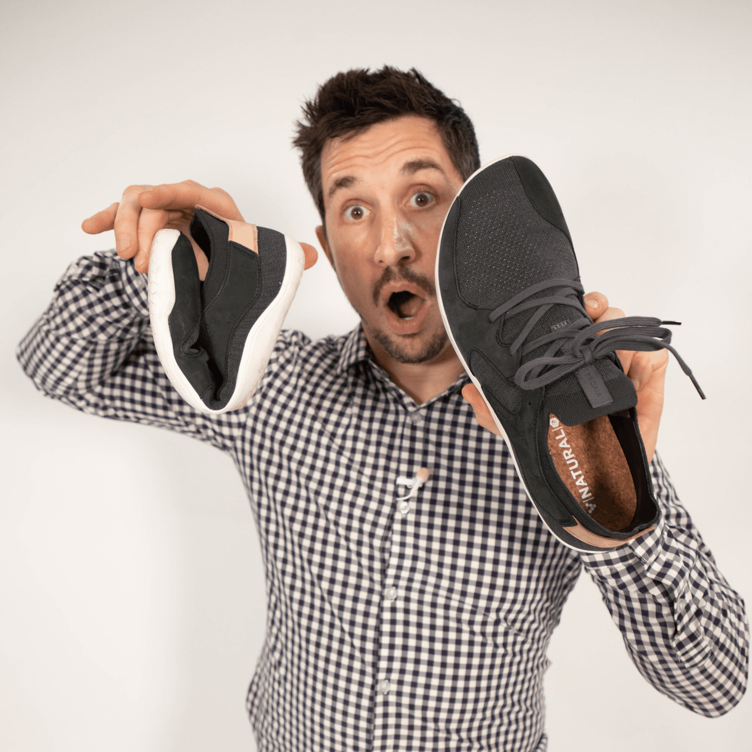 Dr. Mike holding VivoBarefoot shoes