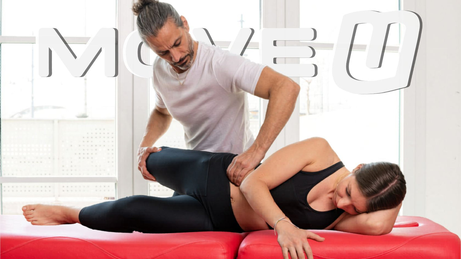Man performing psoas release on female client